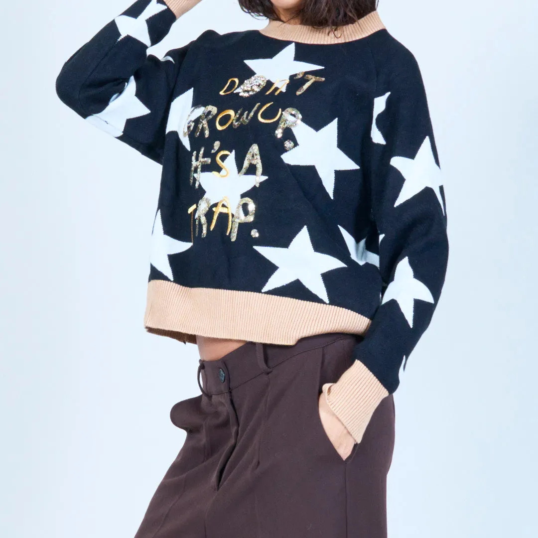 Star print sweater with playful text wholesale