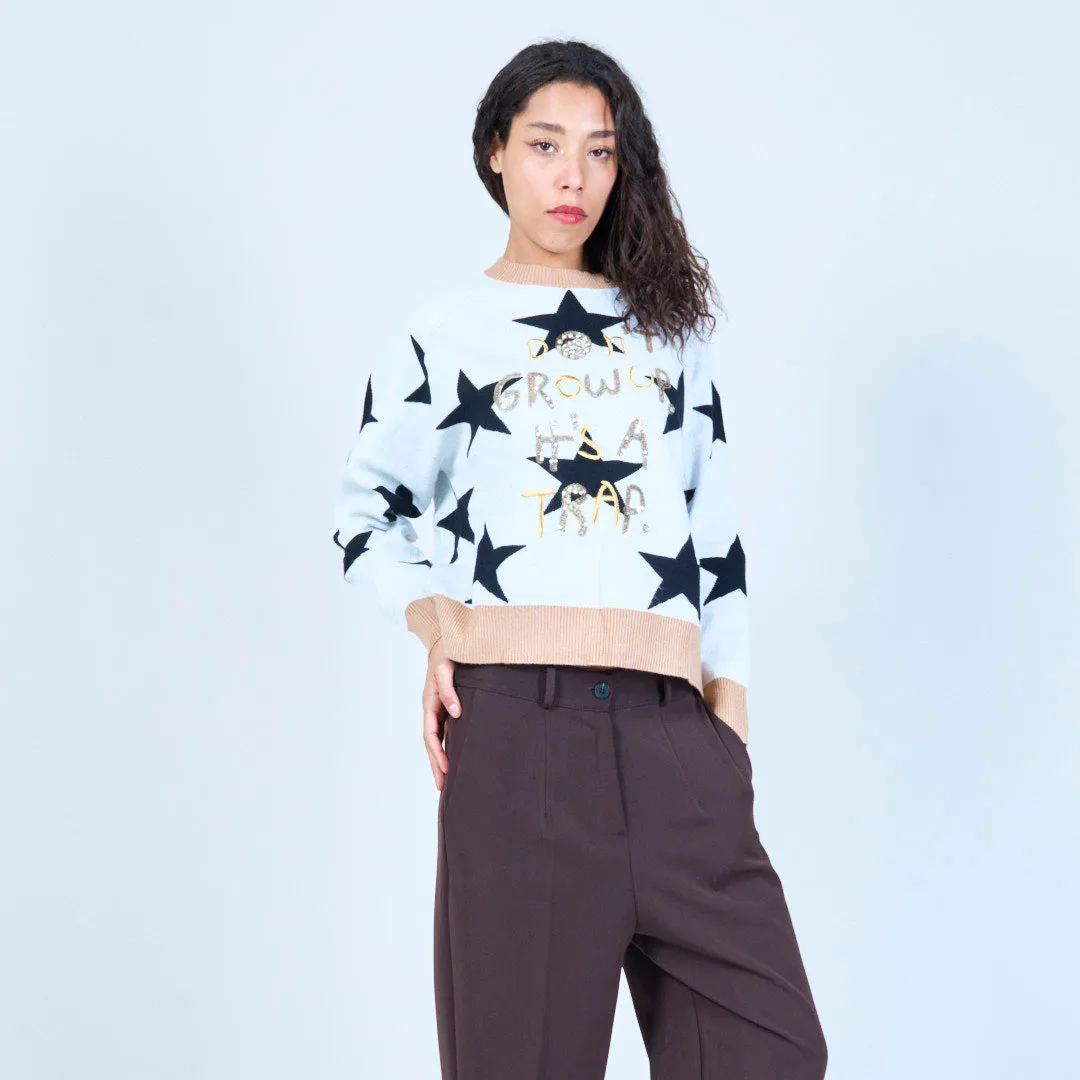 Star print sweater with playful text wholesale